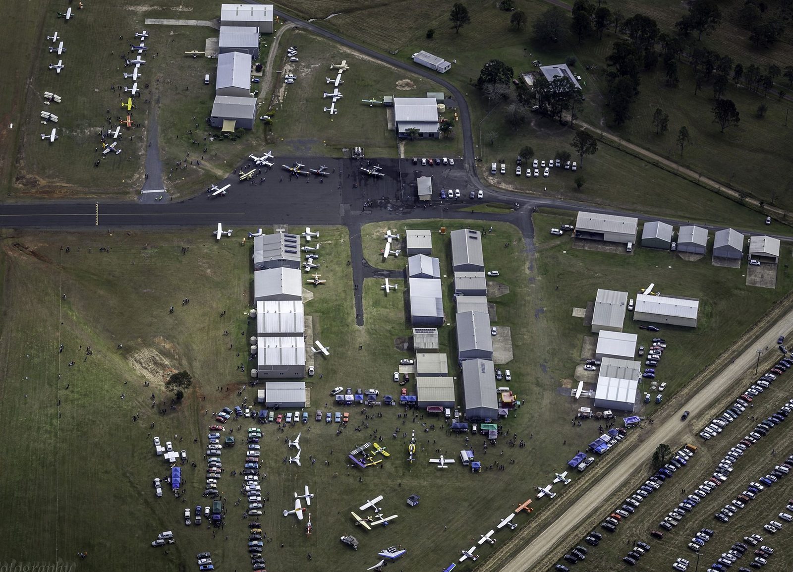 Aircraft parked across the grass at YGYM during a fly-in