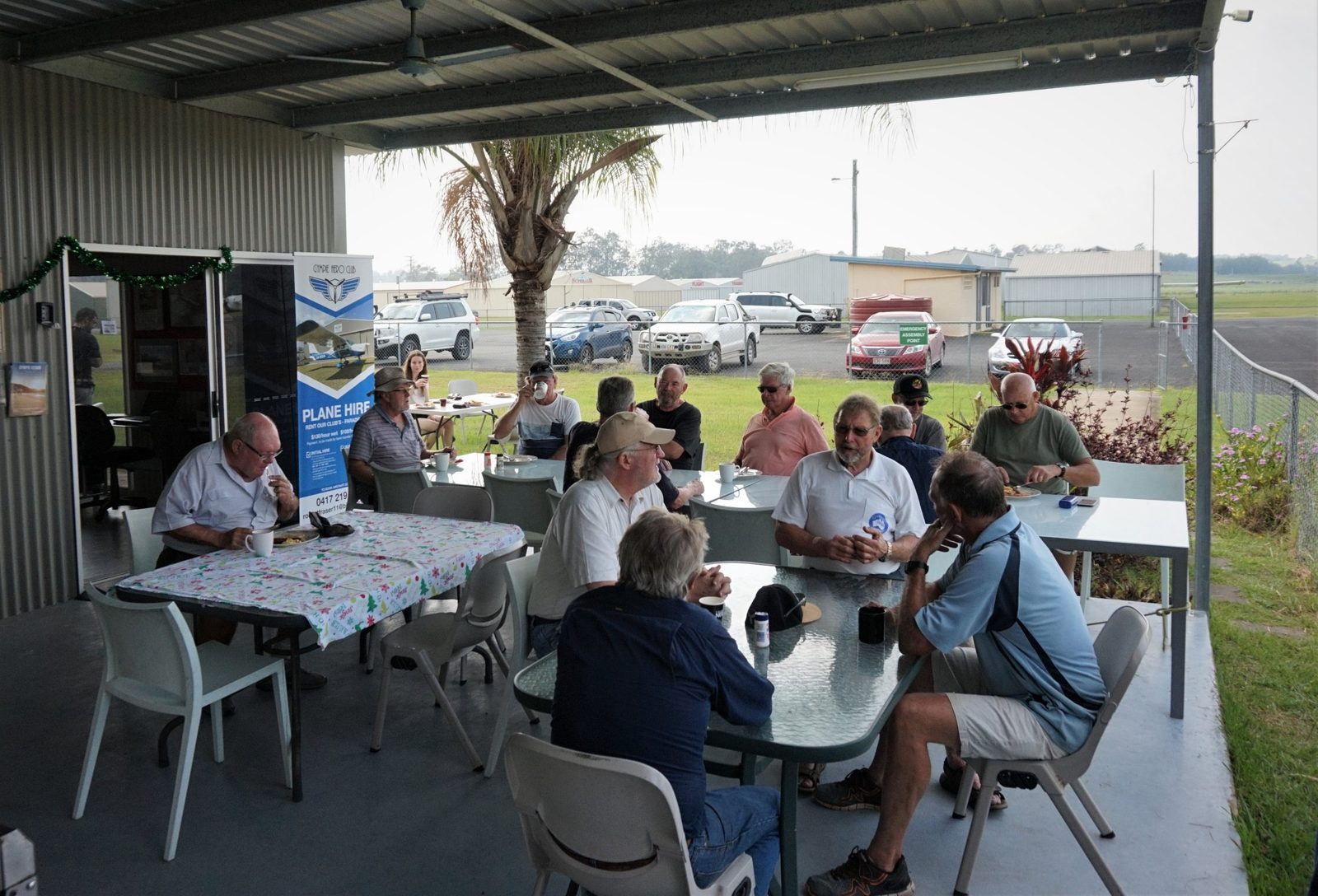 Aviators gathered under the clubhouse verandah at YGYM