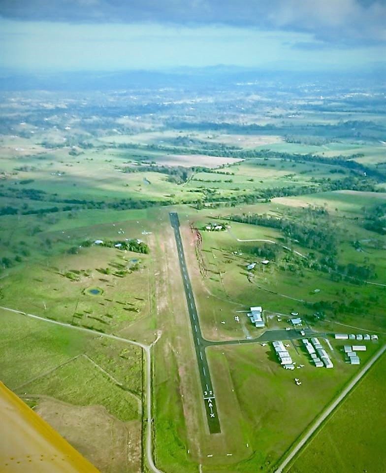 Aerial view of Gympie Aerodrome runway 14/32 and surrounding farmland